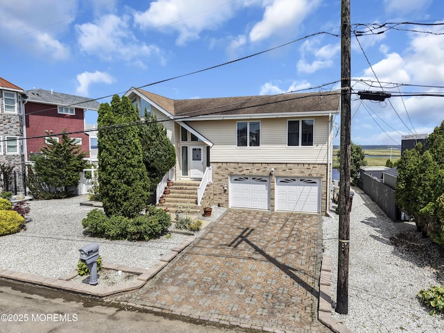 259 Cypress Dr, Bayville, NJ 08721 - view of front of home with a garage, driveway, and brick siding