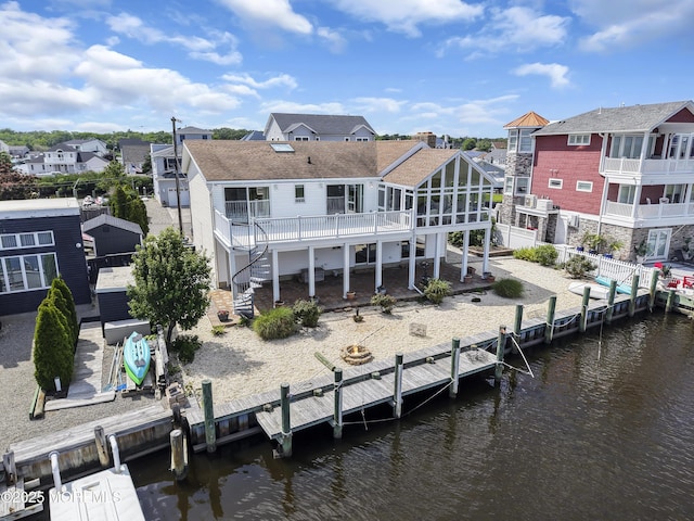 259 Cypress Dr, Bayville, NJ 08721 - rear view of property featuring a residential view, a deck with water view, and a shingled roof