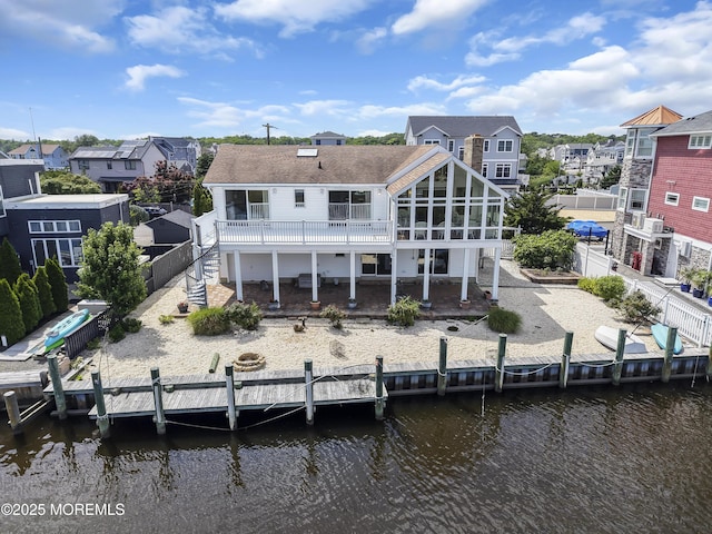 259 Cypress Dr, Bayville, NJ 08721 - back of house with a deck with water view, a fenced backyard, a patio, and a residential view