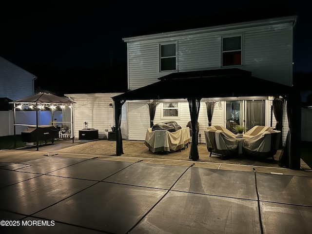 16 Constitution Dr, Howell, NJ 07731 - patio at night with a patio, a grill, and a gazebo