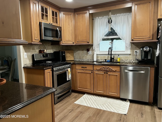 16 Constitution Dr, Howell, NJ 07731 - kitchen with appliances with stainless steel finishes, brown cabinets, light wood-style floors, and backsplash