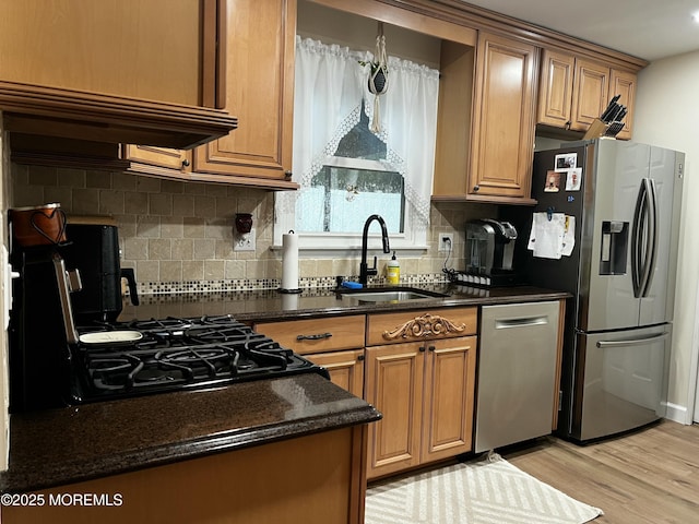 16 Constitution Dr, Howell, NJ 07731 - kitchen featuring stainless steel appliances, light wood finished floors, tasteful backsplash, dark stone counters, and brown cabinets