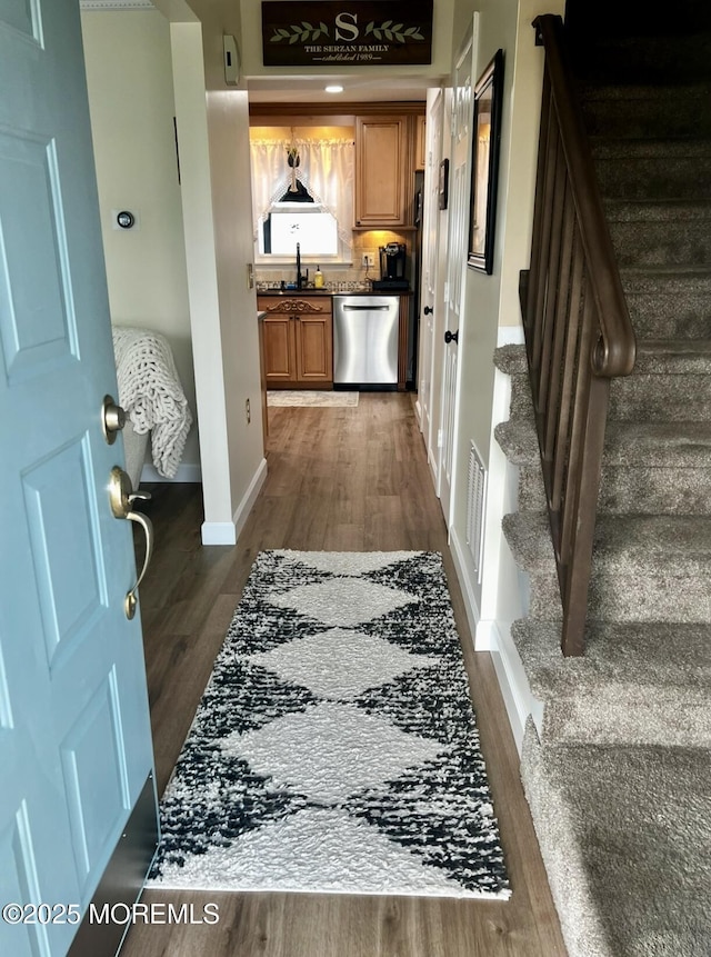 16 Constitution Dr, Howell, NJ 07731 - foyer featuring dark wood-style flooring and stairway