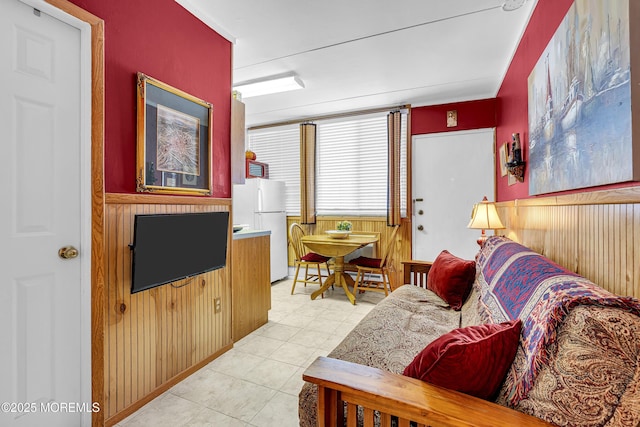 28 Fremont Ave Unit B12, Seaside Heights, NJ 08751 - living area featuring wooden walls, light tile patterned floors, and wainscoting