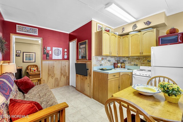 28 Fremont Ave Unit B12, Seaside Heights, NJ 08751 - kitchen with white appliances, light countertops, tasteful backsplash, a wainscoted wall, and crown molding