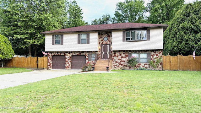 9 Longfellow Ter, Morganville, NJ 07751 - split foyer home with stone siding, concrete driveway, and an attached garage