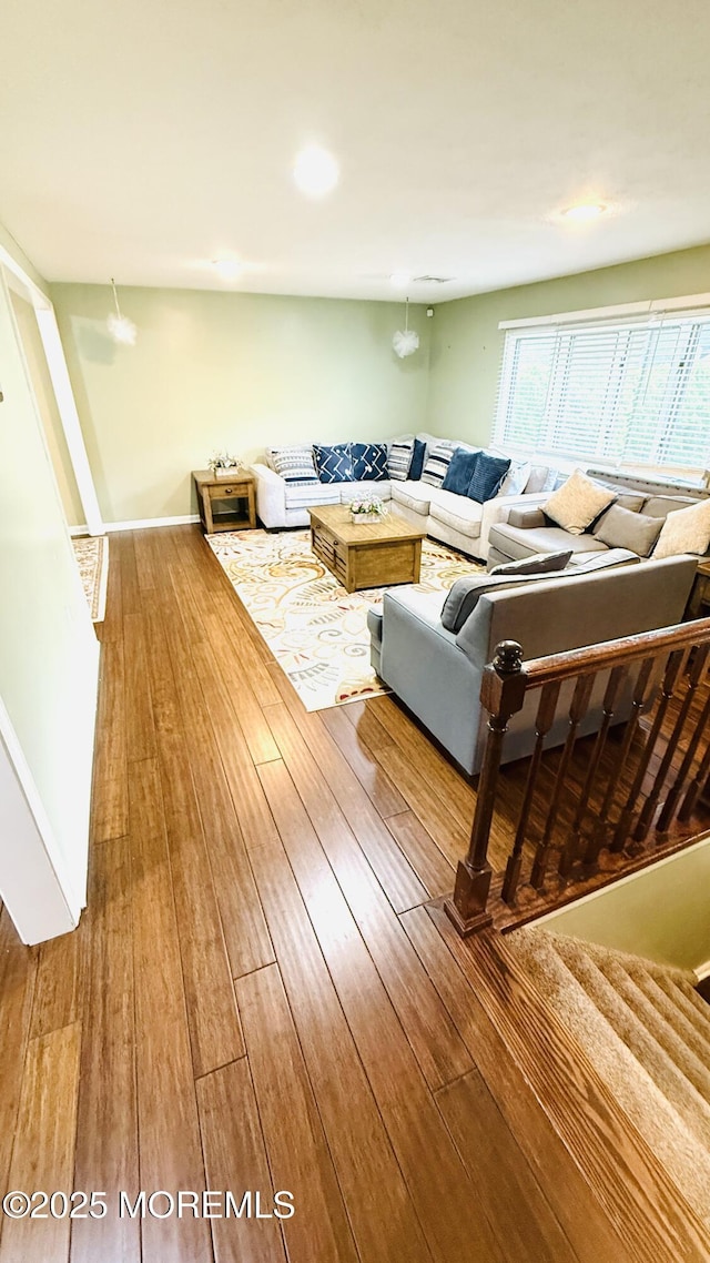9 Longfellow Ter, Morganville, NJ 07751 - living room with hardwood / wood-style floors and stairs