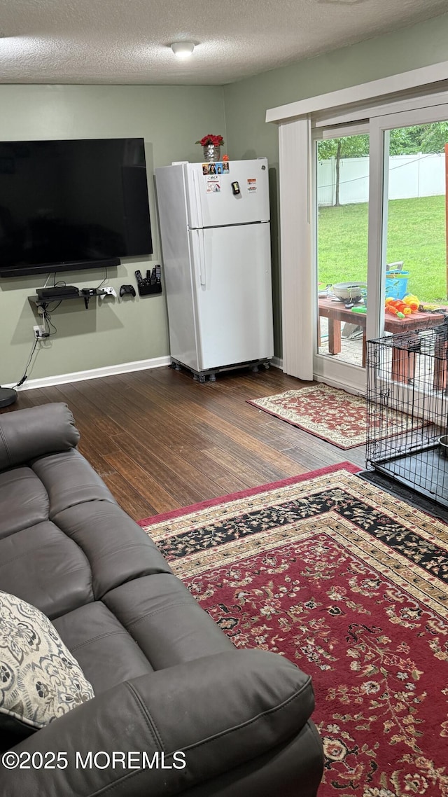 9 Longfellow Ter, Morganville, NJ 07751 - living room featuring dark wood-style floors and a textured ceiling
