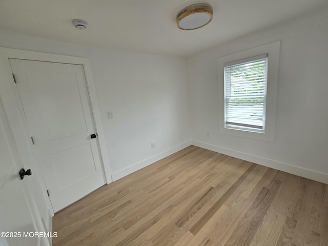 412 Ridge Ave, Neptune Township, NJ 07753 - spare room featuring a smoke detector and light wood-style flooring