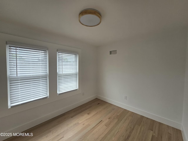 412 Ridge Ave, Neptune Township, NJ 07753 - spare room featuring light wood finished floors and baseboards