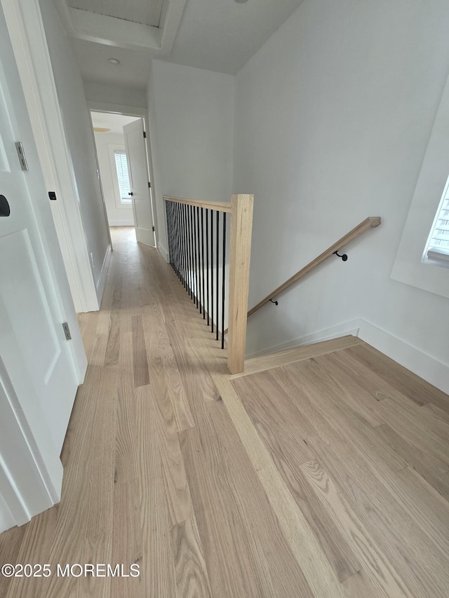 412 Ridge Ave, Neptune Township, NJ 07753 - hallway with wood finished floors, an upstairs landing, and attic access
