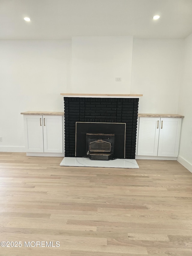 412 Ridge Ave, Neptune Township, NJ 07753 - detailed view of a fireplace, wood finished floors, and recessed lighting