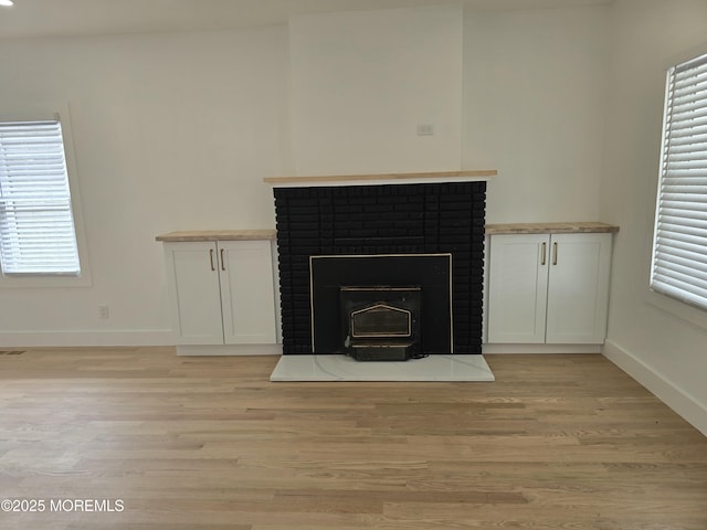 412 Ridge Ave, Neptune Township, NJ 07753 - detailed view of wood finished floors and a brick fireplace
