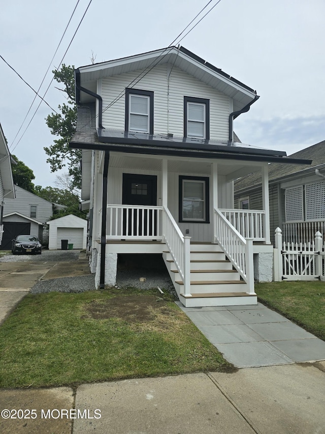 412 Ridge Ave, Neptune Township, NJ 07753 - view of front of house featuring covered porch and a garage
