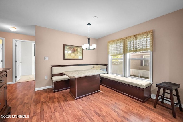 14 Village Rd, Morganville, NJ 07751 - dining space featuring a chandelier, wood finished floors, and breakfast area
