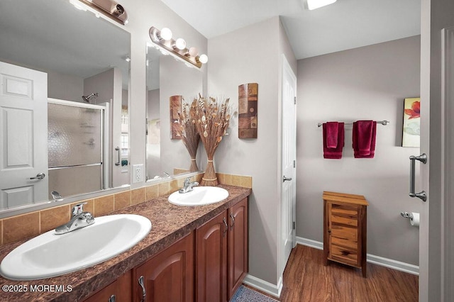 14 Village Rd, Morganville, NJ 07751 - bathroom featuring double vanity, wood finished floors, and a stall shower