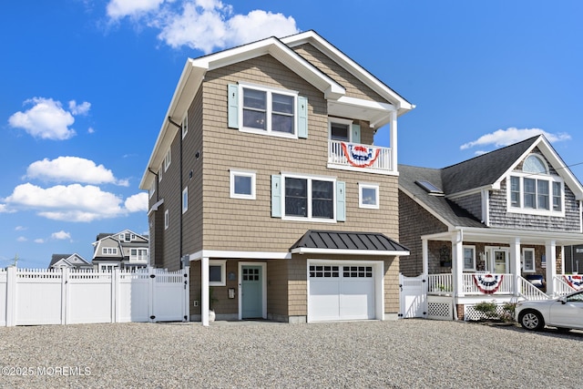 6 Pearce Ct, Manasquan, NJ 08736 - view of front facade featuring a gate, covered porch, a garage, and a standing seam roof