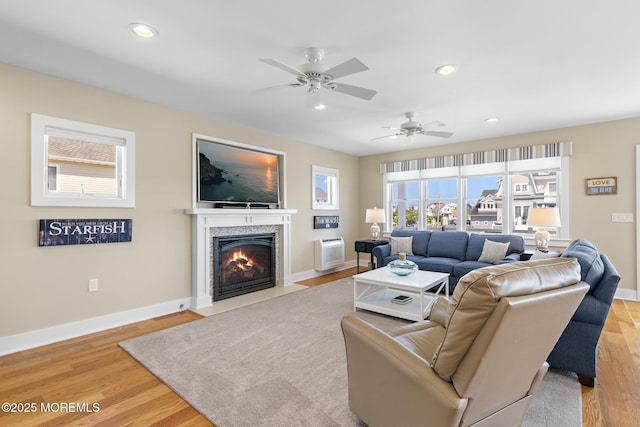 6 Pearce Ct, Manasquan, NJ 08736 - living room featuring a tiled fireplace, wood finished floors, a ceiling fan, and recessed lighting
