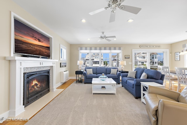 6 Pearce Ct, Manasquan, NJ 08736 - living area with a ceiling fan, recessed lighting, a warm lit fireplace, and wood finished floors