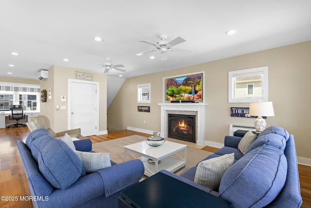 6 Pearce Ct, Manasquan, NJ 08736 - living area featuring ceiling fan, a fireplace with flush hearth, wood finished floors, and recessed lighting