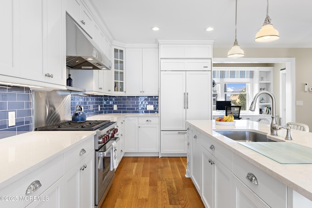 6 Pearce Ct, Manasquan, NJ 08736 - kitchen with high quality appliances, under cabinet range hood, decorative light fixtures, white cabinets, and recessed lighting