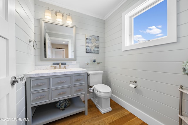 6 Pearce Ct, Manasquan, NJ 08736 - half bath with crown molding, wood finished floors, vanity, and wood walls