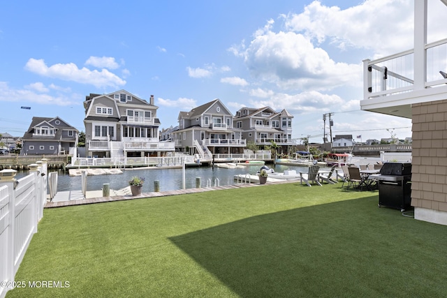 6 Pearce Ct, Manasquan, NJ 08736 - view of green lawn with a water view and a boat dock