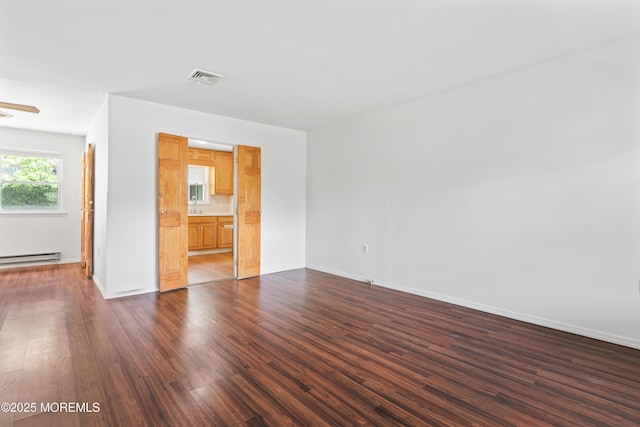 41 Falmouth Ave Unit 72, Whiting, NJ 08759 - unfurnished room featuring dark wood-style flooring, a baseboard heating unit, and a ceiling fan