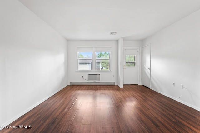 41 Falmouth Ave Unit 72, Whiting, NJ 08759 - spare room featuring dark wood-type flooring, a baseboard heating unit, and a wall unit AC