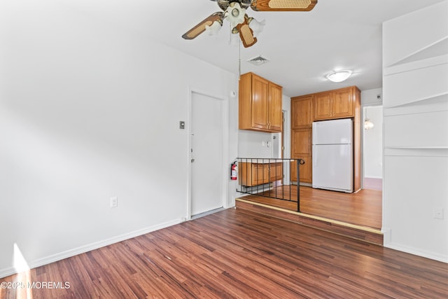 41 Falmouth Ave Unit 72, Whiting, NJ 08759 - kitchen with freestanding refrigerator, a ceiling fan, wood finished floors, and brown cabinetry