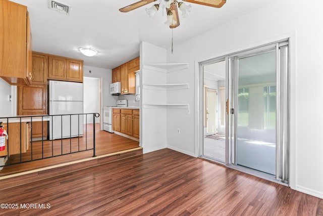 41 Falmouth Ave Unit 72, Whiting, NJ 08759 - kitchen featuring white appliances, ceiling fan, dark wood finished floors, and brown cabinetry