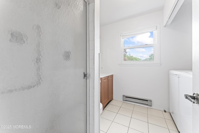 41 Falmouth Ave Unit 72, Whiting, NJ 08759 - washroom featuring baseboard heating, independent washer and dryer, and light tile patterned floors