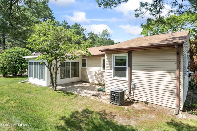 41 Falmouth Ave Unit 72, Whiting, NJ 08759 - back of property featuring a sunroom, a lawn, a shingled roof, and a patio