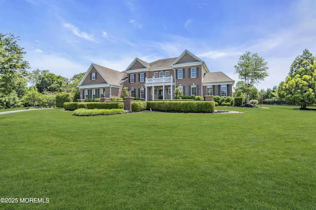 4 Geraldine Ct, Farmingdale, NJ 07727 - colonial home with a balcony, brick siding, and a front yard