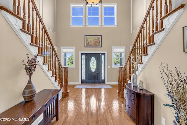 4 Geraldine Ct, Farmingdale, NJ 07727 - foyer entrance featuring stairway, hardwood / wood-style flooring, and a high ceiling