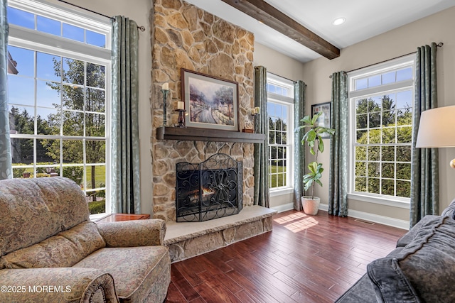 4 Geraldine Ct, Farmingdale, NJ 07727 - living room featuring beam ceiling, a stone fireplace, and dark wood-type flooring