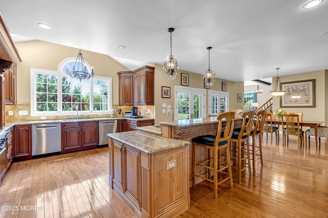4 Geraldine Ct, Farmingdale, NJ 07727 - kitchen with dishwasher, a chandelier, light wood finished floors, a kitchen breakfast bar, and a center island