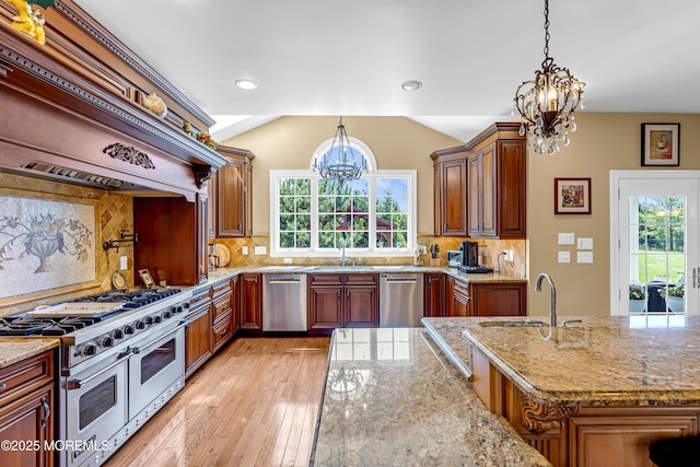 4 Geraldine Ct, Farmingdale, NJ 07727 - kitchen with stainless steel appliances, a chandelier, light wood-type flooring, premium range hood, and light stone counters