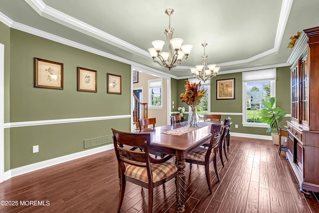4 Geraldine Ct, Farmingdale, NJ 07727 - dining space with a chandelier, a raised ceiling, dark wood-type flooring, healthy amount of natural light, and ornamental molding