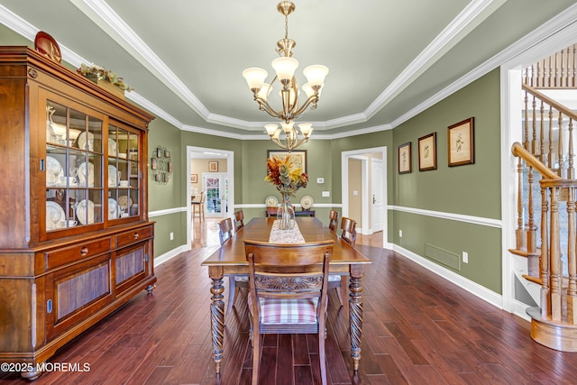 4 Geraldine Ct, Farmingdale, NJ 07727 - dining room featuring a chandelier, dark wood-type flooring, stairway, a raised ceiling, and crown molding