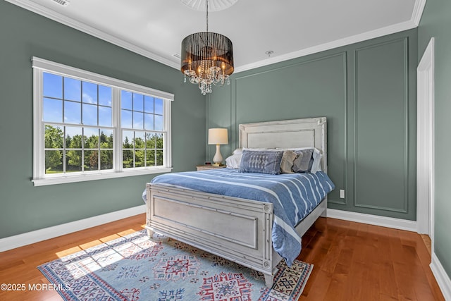 4 Geraldine Ct, Farmingdale, NJ 07727 - bedroom featuring a chandelier, crown molding, and wood finished floors