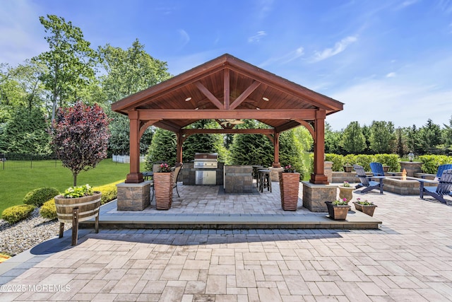 4 Geraldine Ct, Farmingdale, NJ 07727 - view of patio featuring a gazebo, exterior kitchen, and a fire pit