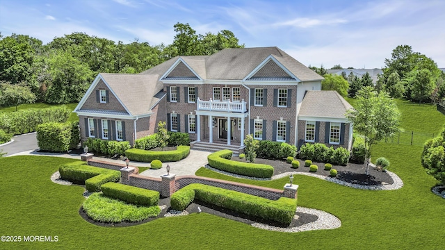4 Geraldine Ct, Farmingdale, NJ 07727 - colonial home with a balcony, a front lawn, and brick siding