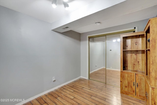 8 Shadow Ridge Ct, Howell, NJ 07731 - unfurnished bedroom with light wood-style flooring and a closet