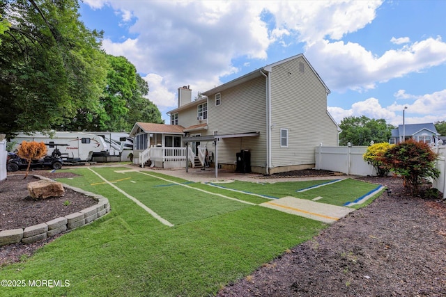 8 Shadow Ridge Ct, Howell, NJ 07731 - rear view of house with a chimney and a wooden deck
