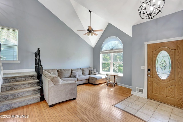 8 Shadow Ridge Ct, Howell, NJ 07731 - entryway with wood-type flooring, a ceiling fan, high vaulted ceiling, a chandelier, and stairway