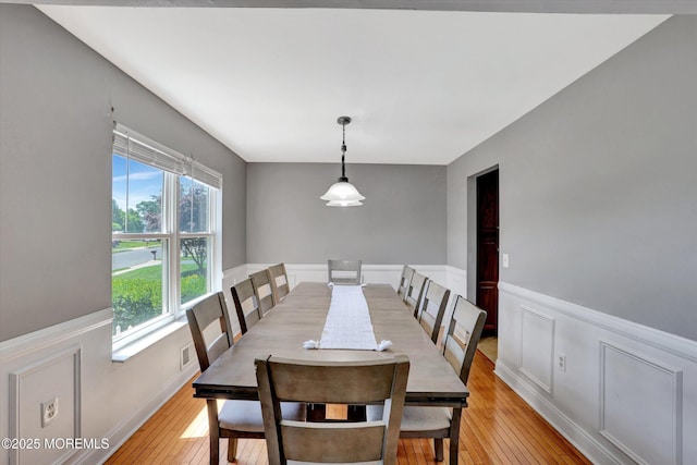 8 Shadow Ridge Ct, Howell, NJ 07731 - dining space with wainscoting, light wood-type flooring, and a decorative wall