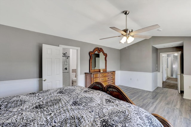8 Shadow Ridge Ct, Howell, NJ 07731 - bedroom with a wainscoted wall, wood finished floors, vaulted ceiling, ceiling fan, and ensuite bath