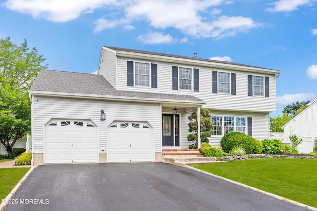 51 Davids Ln, Howell, NJ 07731 - view of front of home featuring driveway, a front lawn, and an attached garage