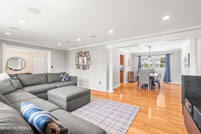 51 Davids Ln, Howell, NJ 07731 - living area featuring decorative columns, crown molding, light wood-style flooring, and recessed lighting